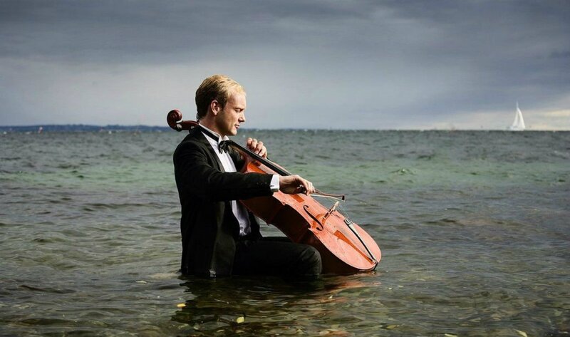 Man Playing Cello in Water