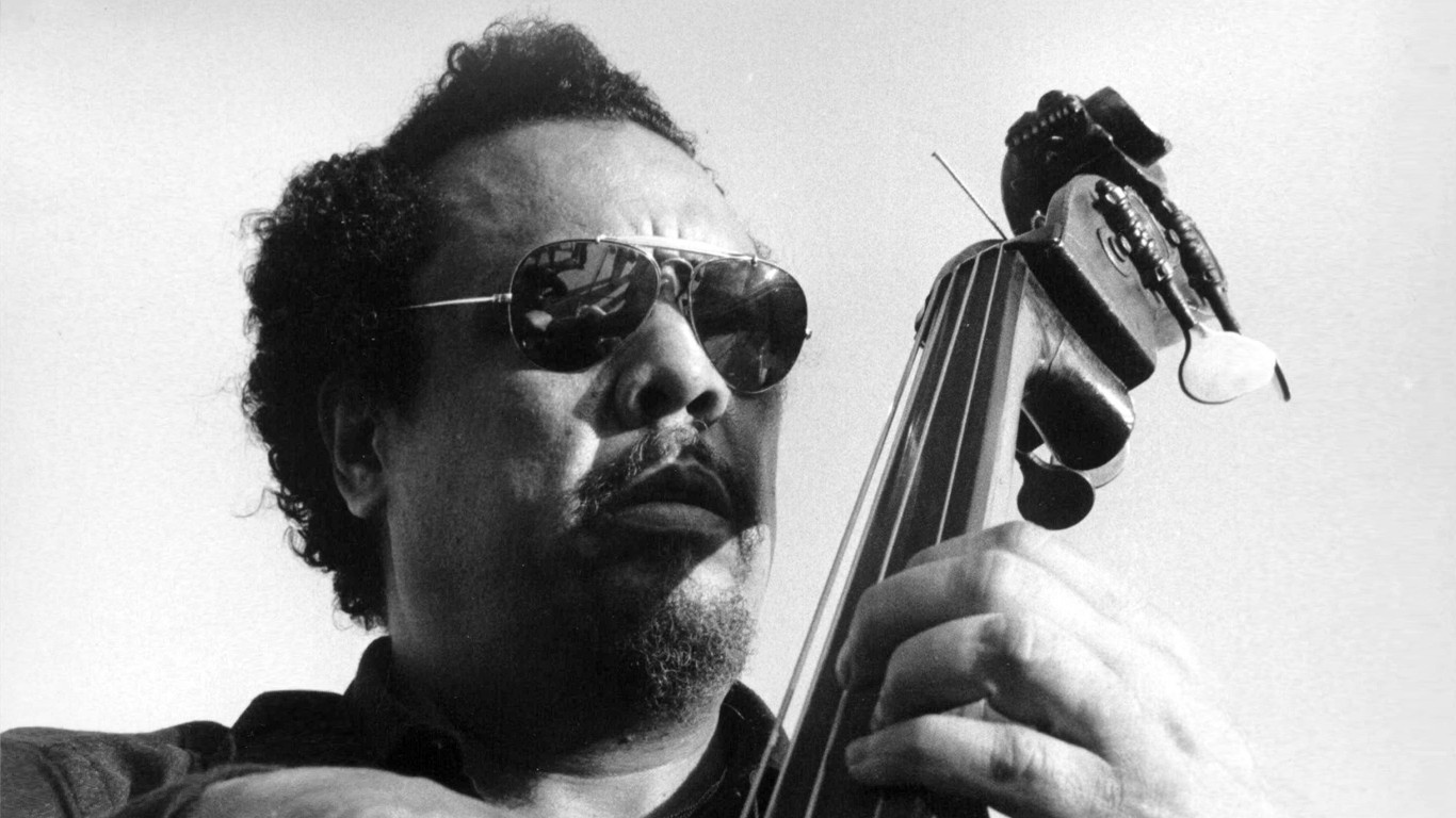man playing cello with sunglasses