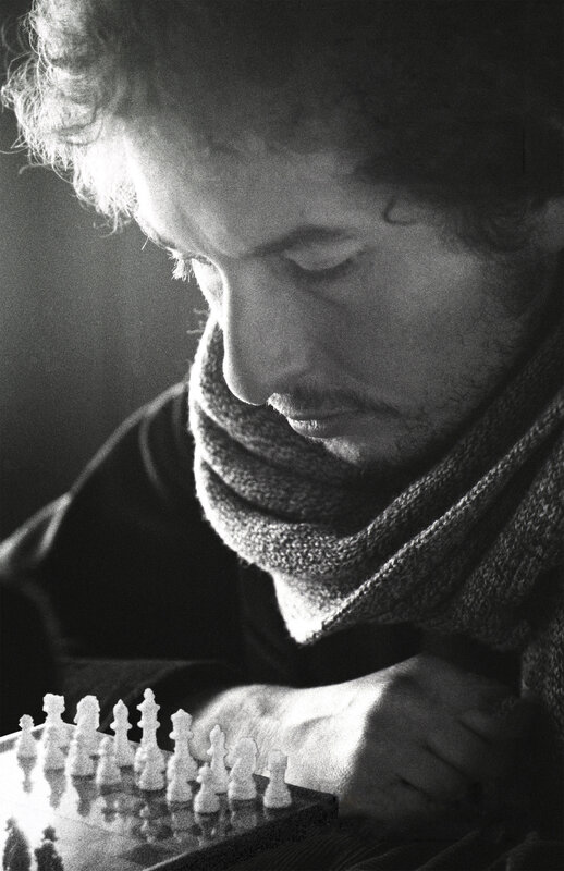 man playing chess in black and white