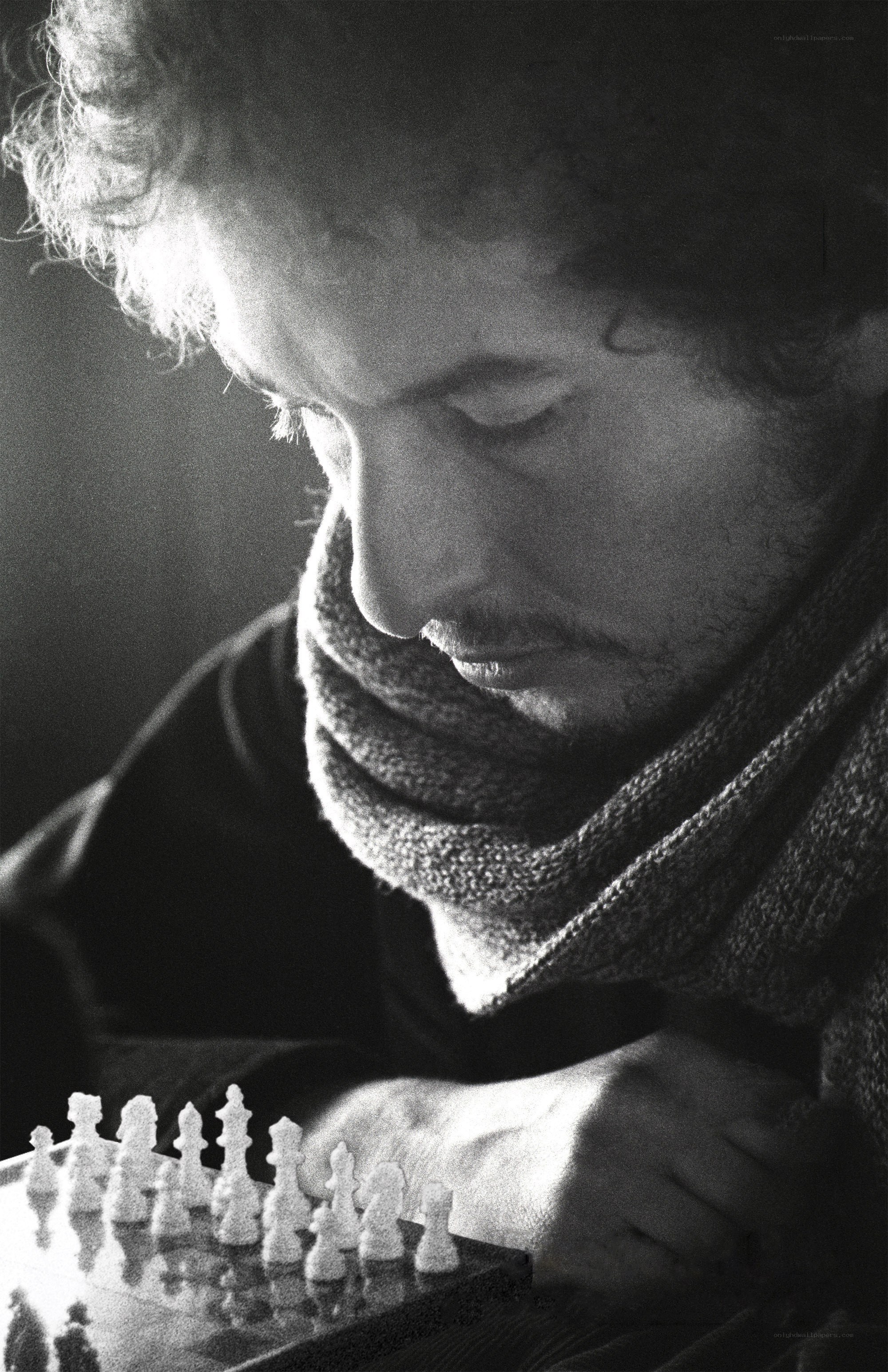 man playing chess in black and white