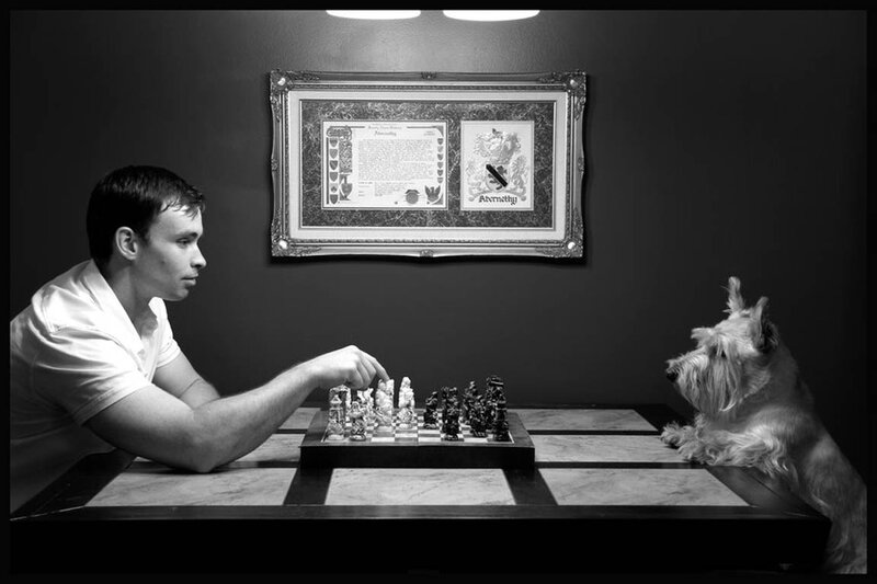 Man Playing Chess with Dog
