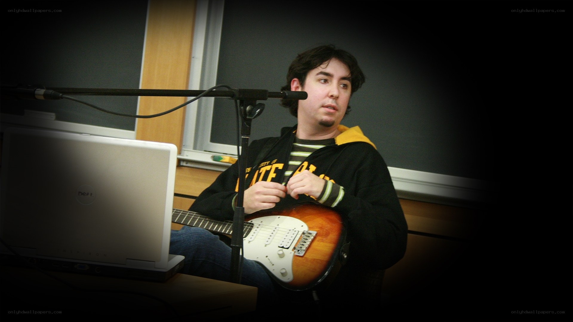man playing electric guitar