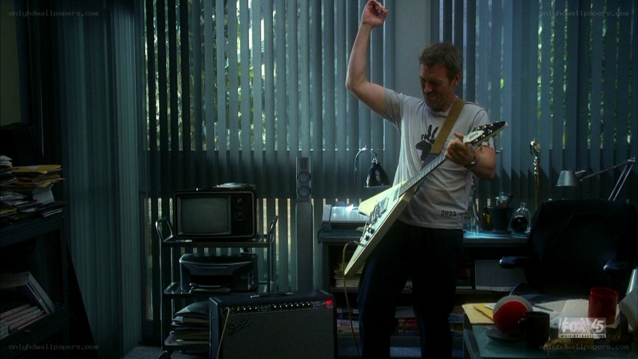 man playing electric guitar