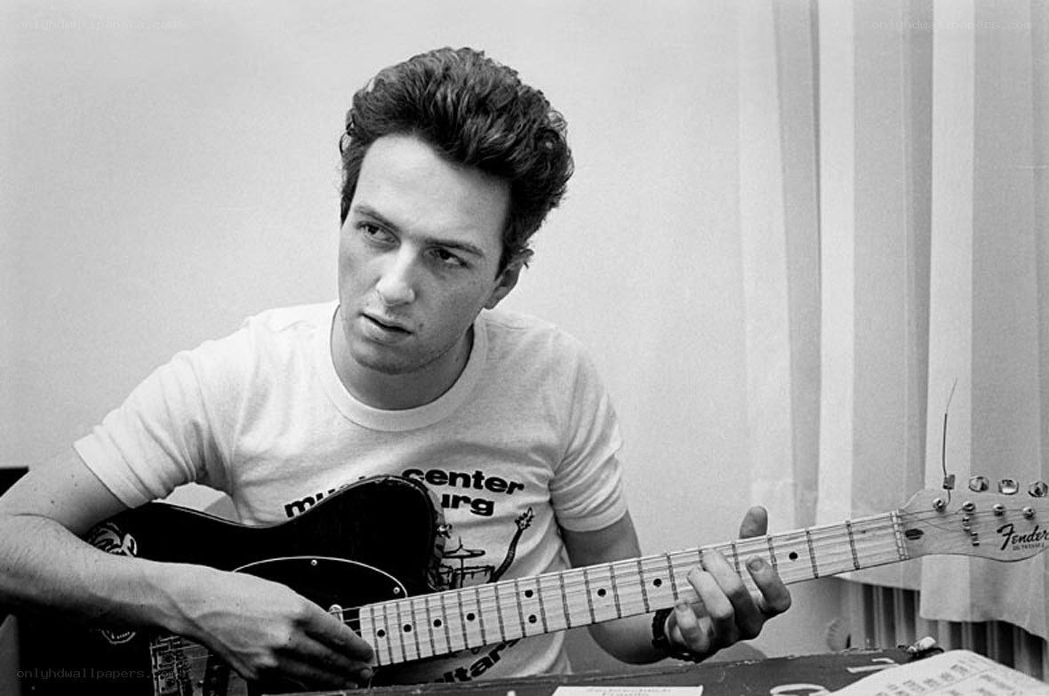 man playing electric guitar
