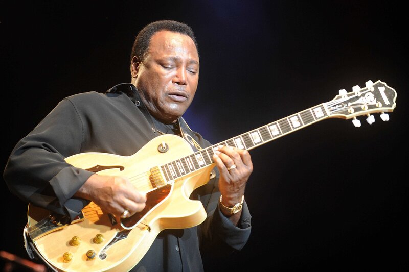 man playing electric guitar