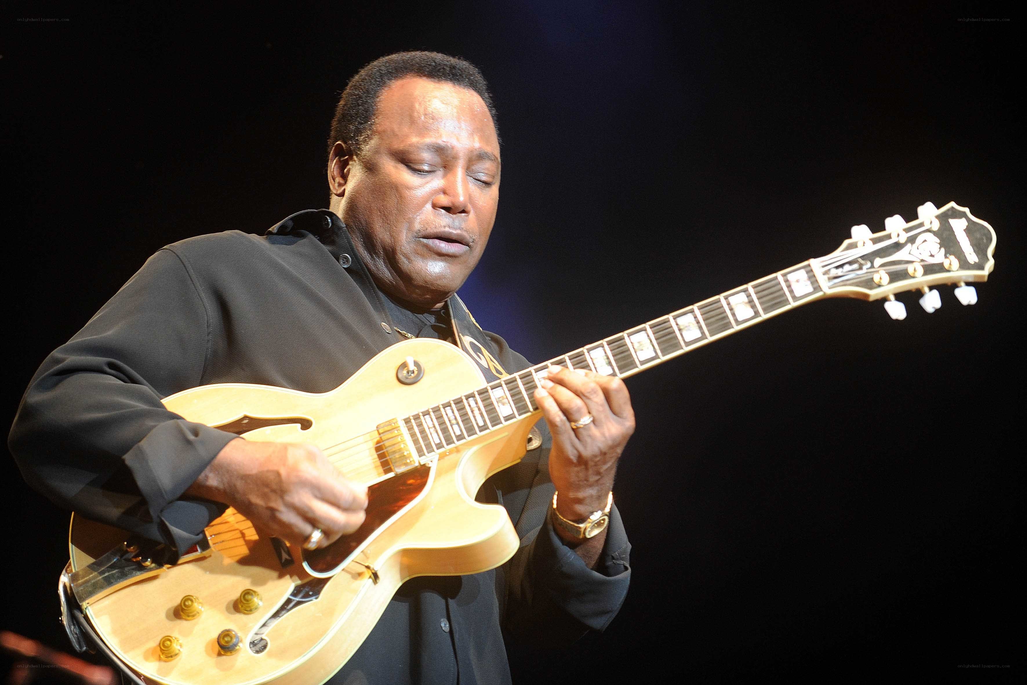 man playing electric guitar