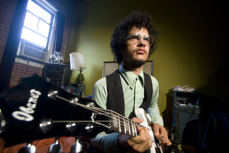 man playing electric guitar