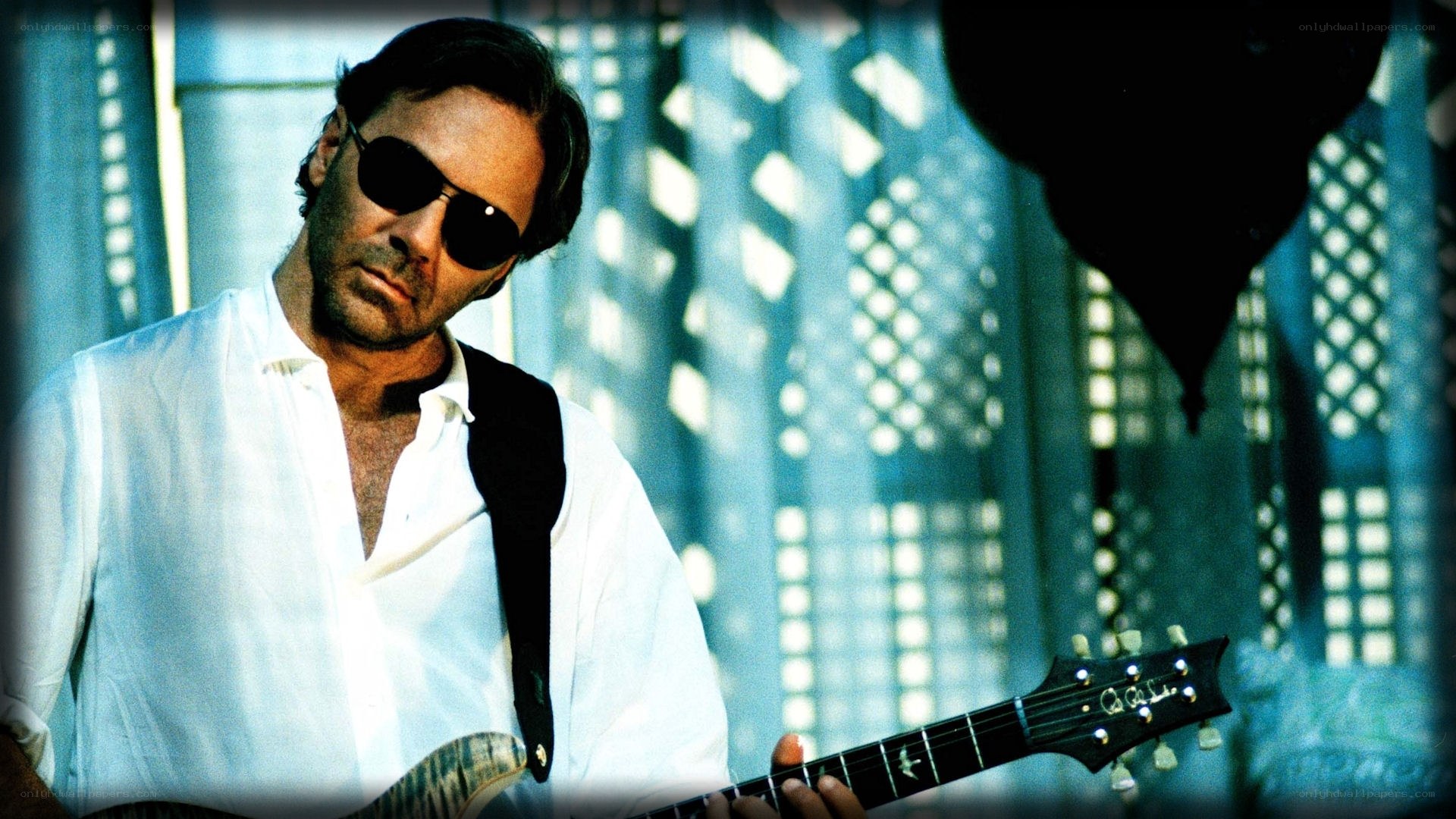 man playing electric guitar