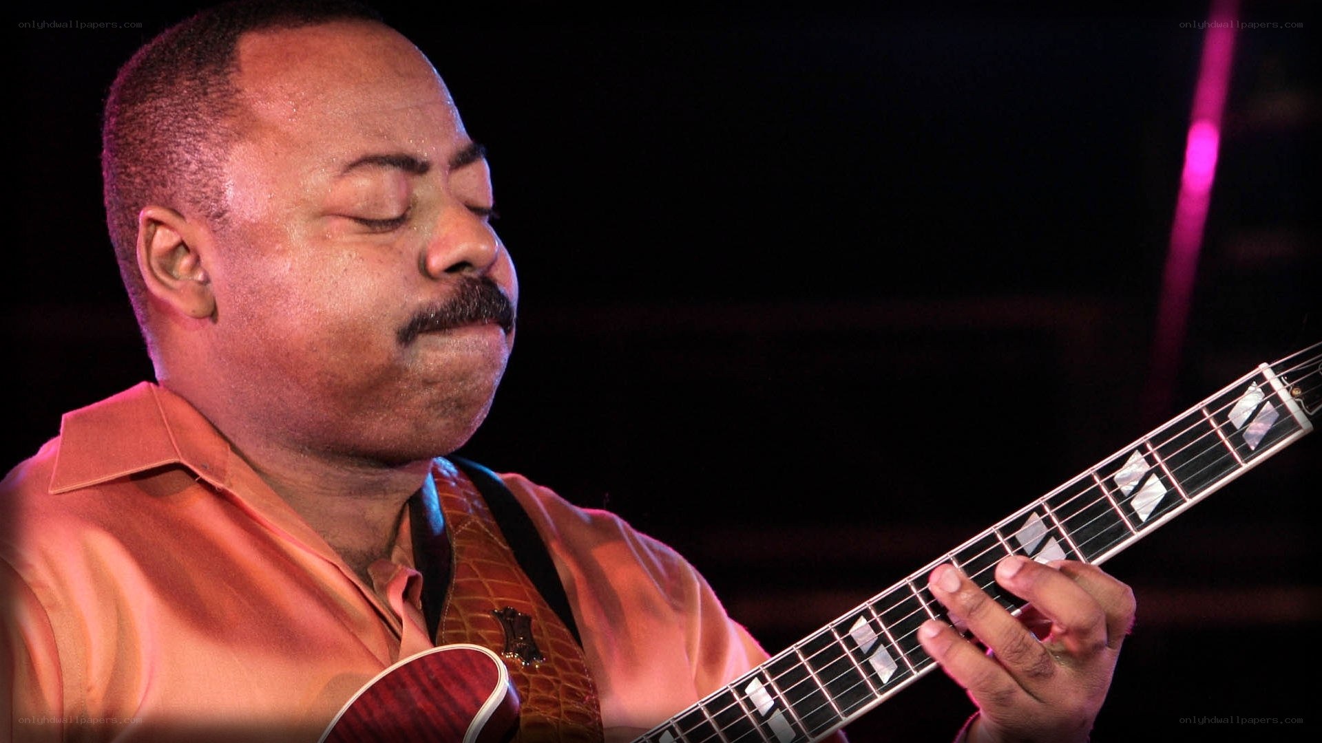 man playing electric guitar