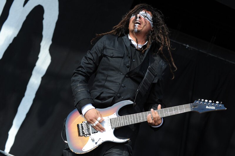 Man Playing Electric Guitar — Black, Energetic, Afternoon