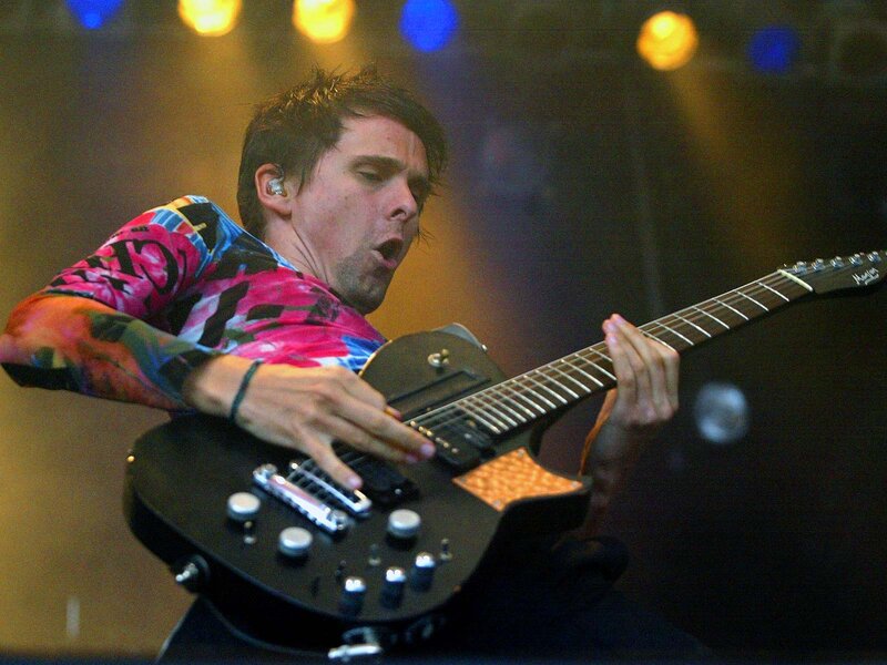 Man Playing Electric Guitar — Black, Energetic, Night, Photograph, Stage Lights, Earplug
