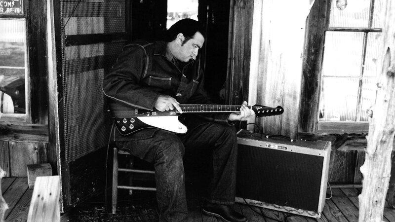 Man Playing Electric Guitar — Black, Focused, Photograph, Amplifier
