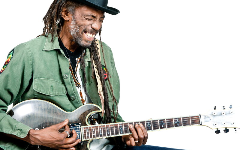 Man Playing Electric Guitar — Green, Energetic