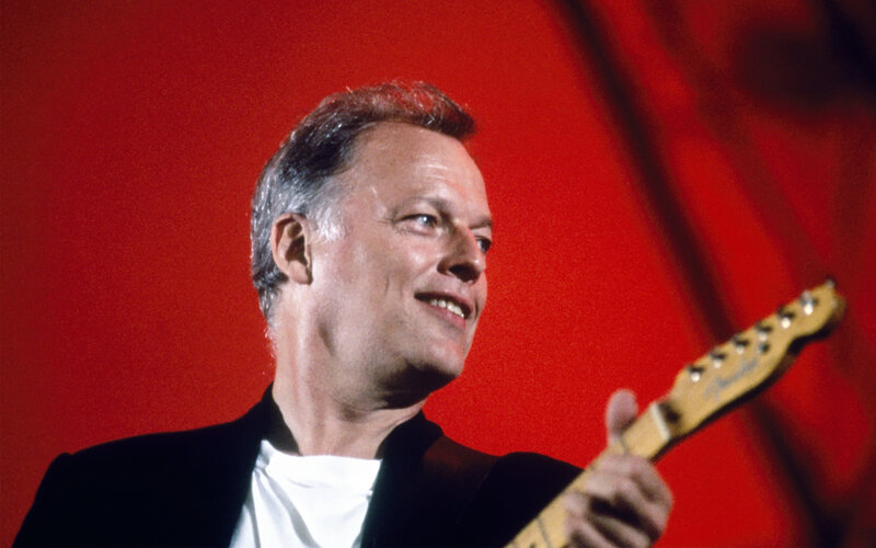 Man playing electric guitar on stage