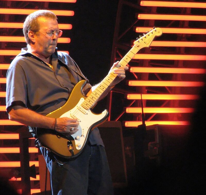 Man Playing Electric Guitar — Orange