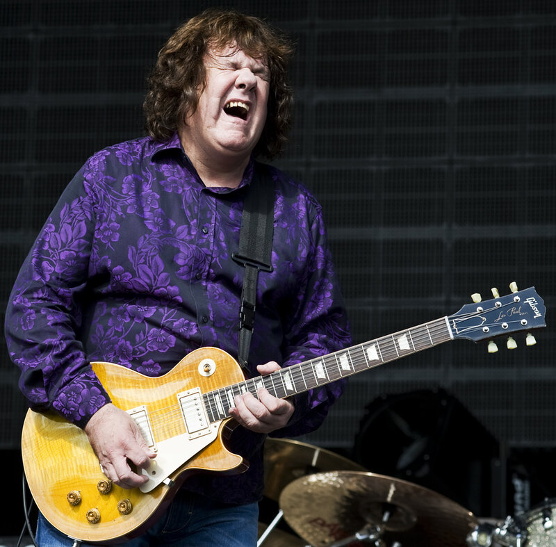 Man Playing Electric Guitar — Purple