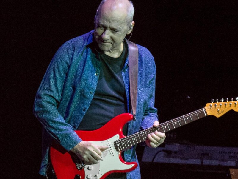 Man Playing Electric Guitar — Red, Focused