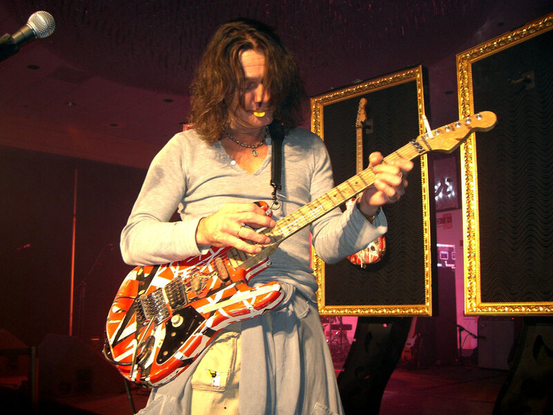 Man Playing Electric Guitar — Red