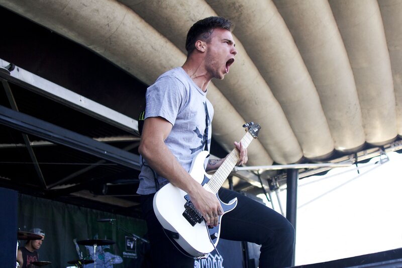 Man Playing Electric Guitar — White, Energetic