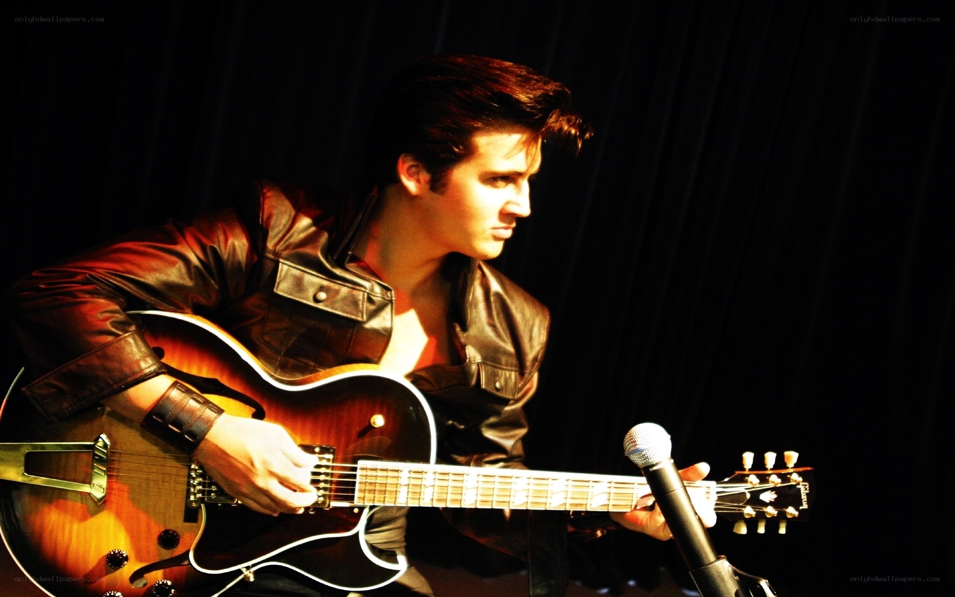 man playing electric guitar