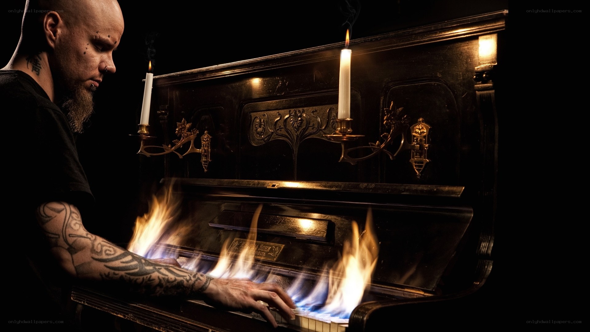 Man playing flaming piano