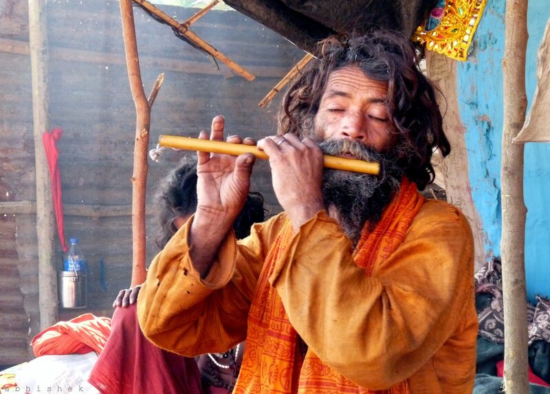 Man Playing Flute — Orange