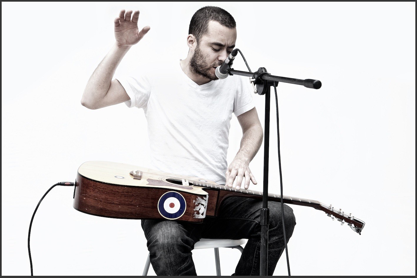 man playing guitar and singing
