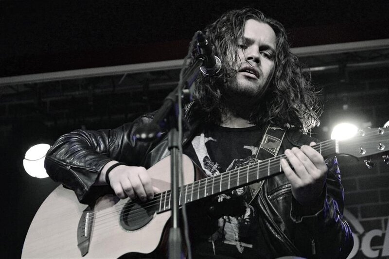 Man Playing Guitar — Black, Focused, Night, Photograph, Microphone