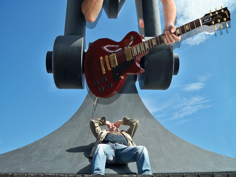 Man Playing Guitar — Blue, Dramatic, Afternoon