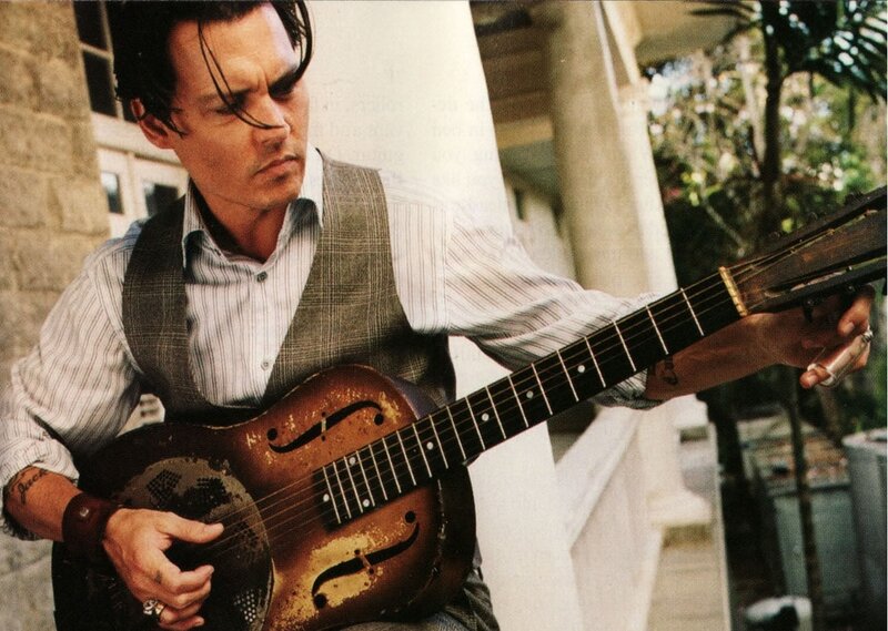 Man Playing Guitar — Brown, Focused, Afternoon