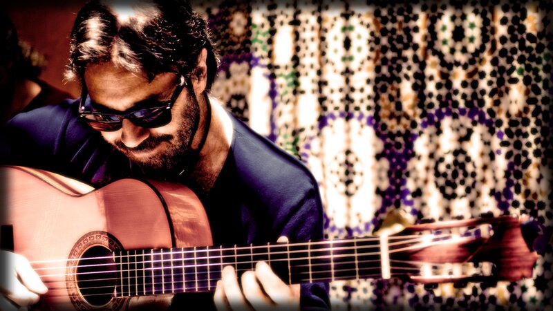 Man Playing Guitar — Brown, Focused, Photograph, Sunglasses