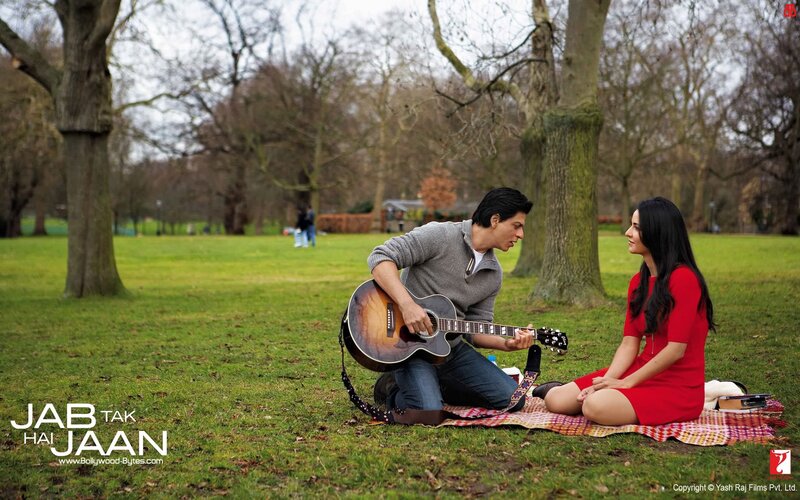 Man playing guitar for woman