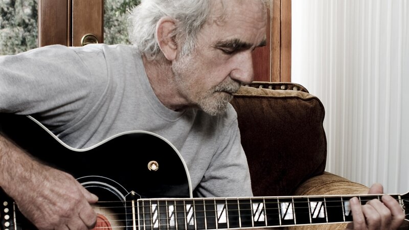 Man Playing Guitar — Gray, Focused