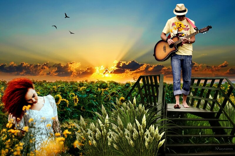 Man Playing Guitar in Field