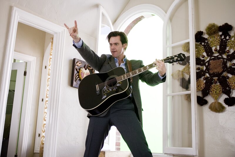 Man playing guitar in house
