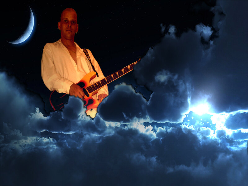 man playing guitar in night sky