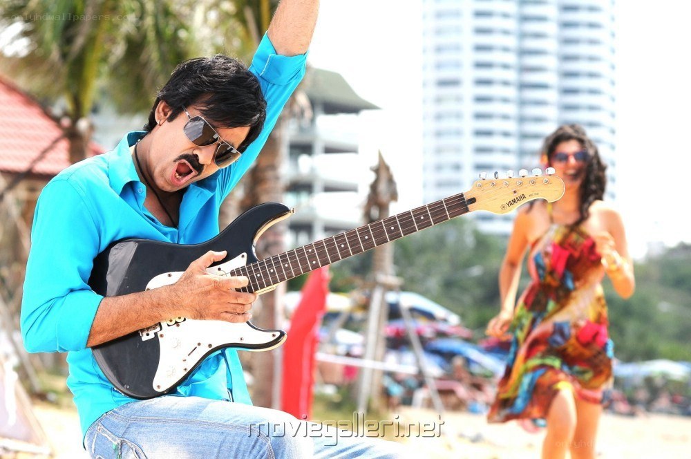 Man playing guitar on beach