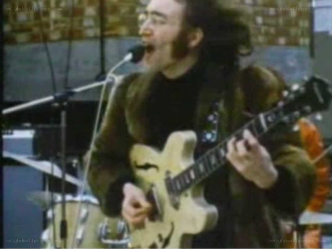 man playing guitar on stage