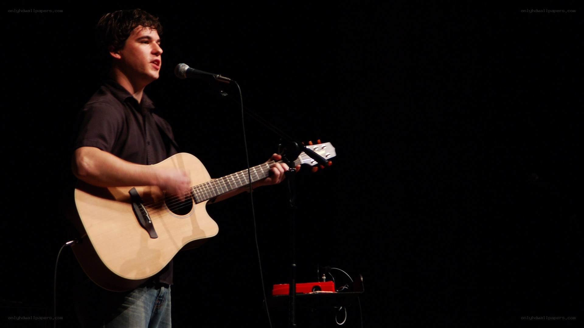 Man playing guitar on stage