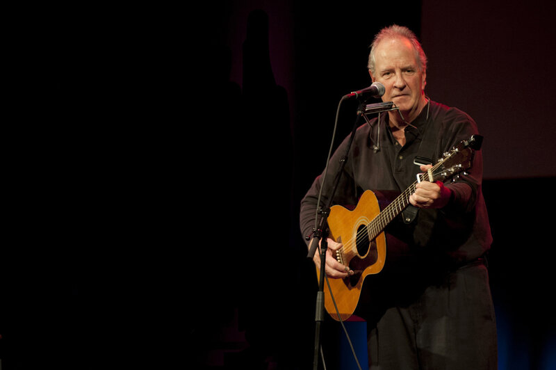 Man playing guitar on stage