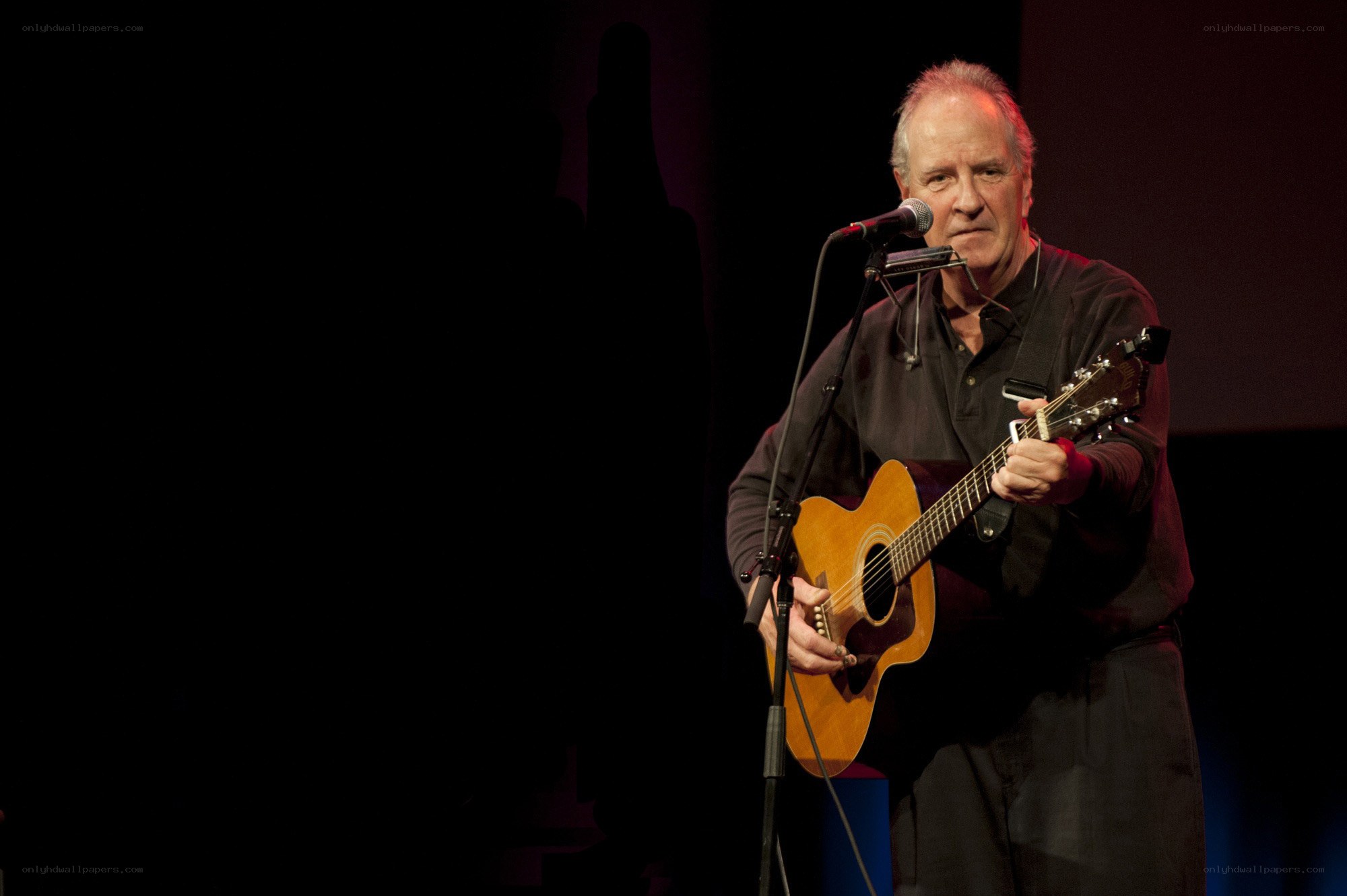 Man playing guitar on stage