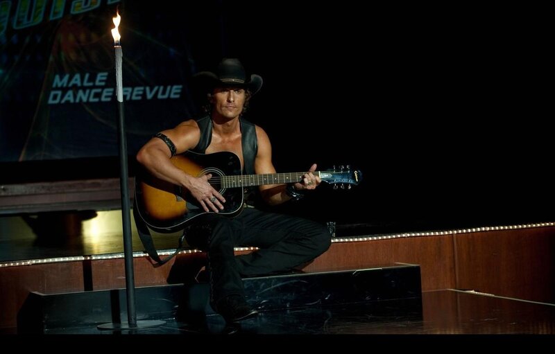 Man Playing Guitar on Stage — Black, Dramatic, Night, Photograph, Cowboy Hat
