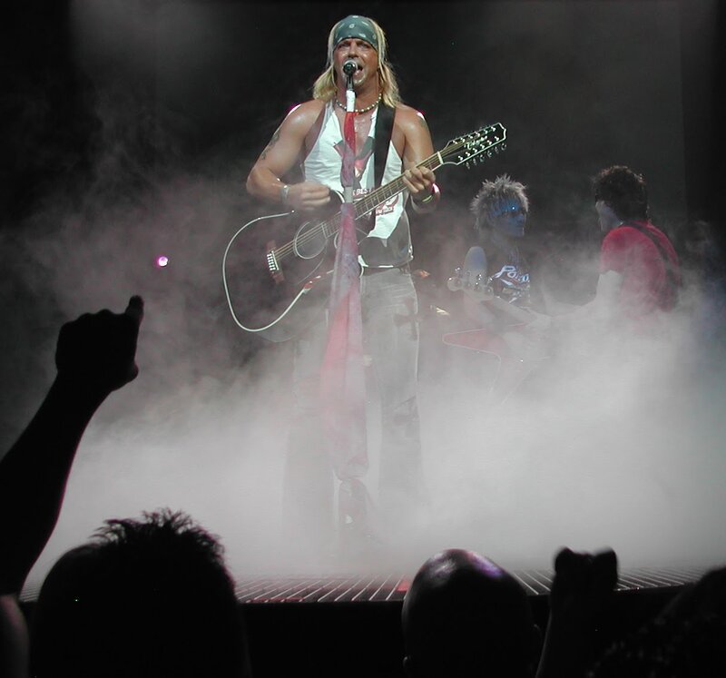Man Playing Guitar on Stage — Black, Dramatic, Night, Photograph
