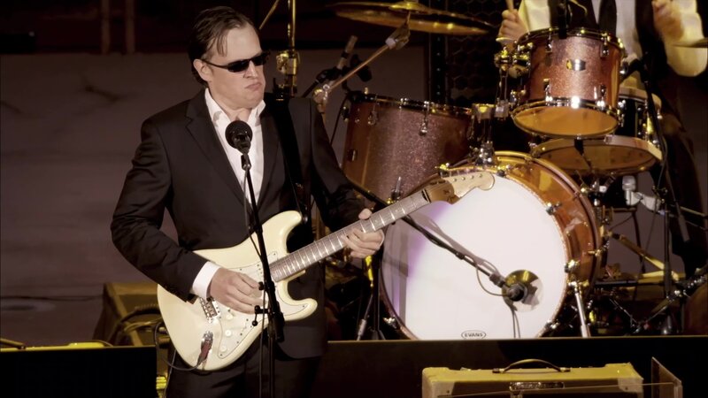 Man Playing Guitar on Stage — Black, Focused, Night