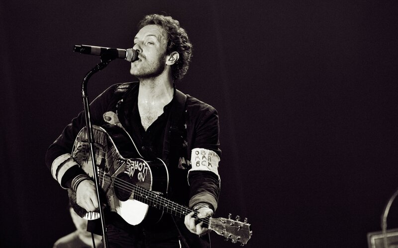 Man Playing Guitar on Stage — Black, Intense