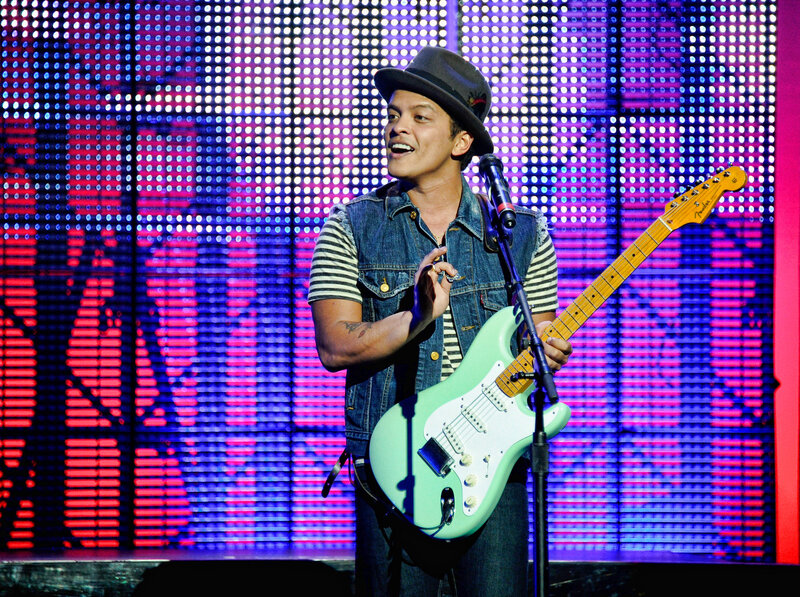 Man Playing Guitar on Stage — Blue