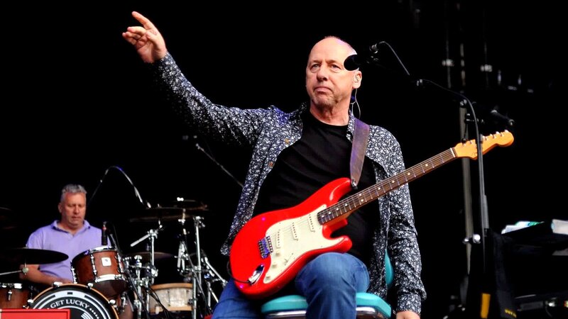 Man Playing Guitar on Stage — Red, Energetic