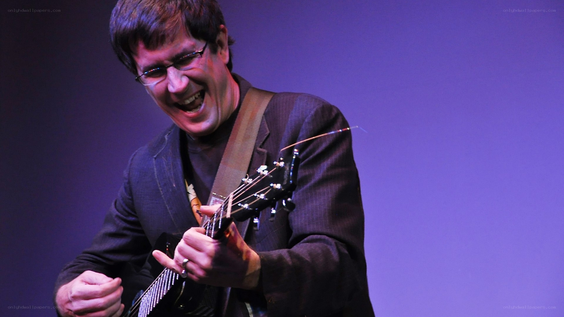 Man playing guitar on stage