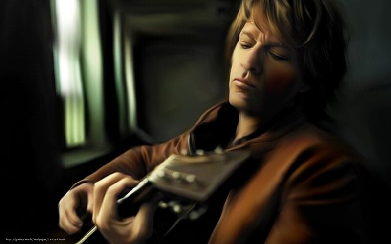 man playing guitar on train