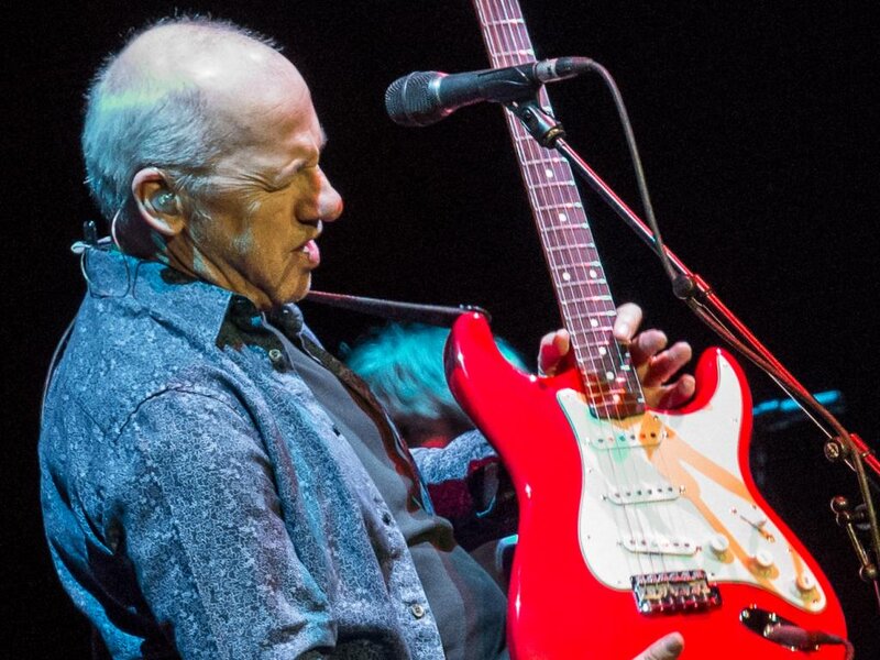 Man Playing Guitar — Red, Focused
